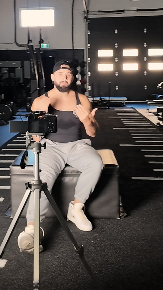 Noah Merriby filming with a camera on a tripod